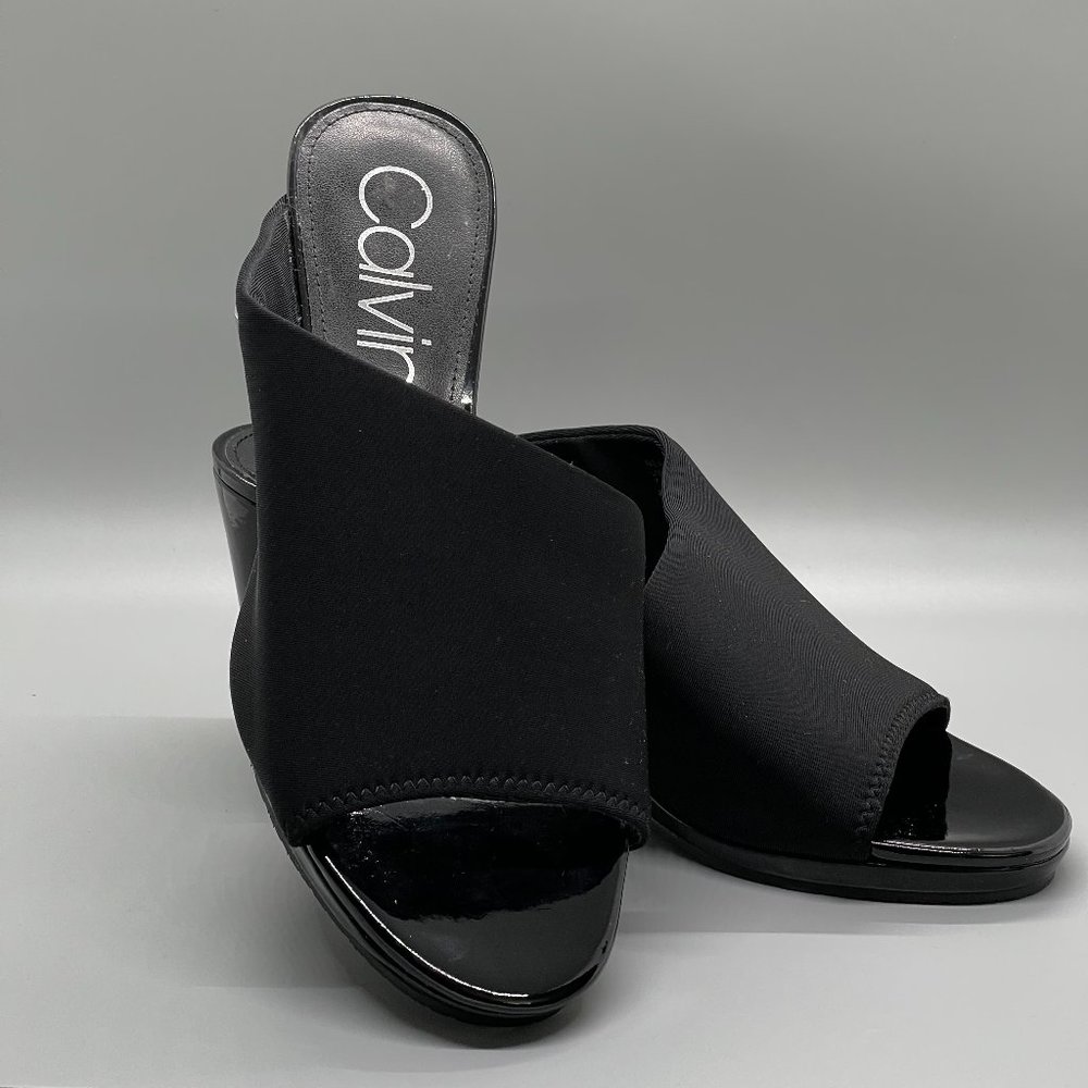 Calvin Klein Women's Open Toe Patent Leather Crib Sandals with Strap and Logo.
